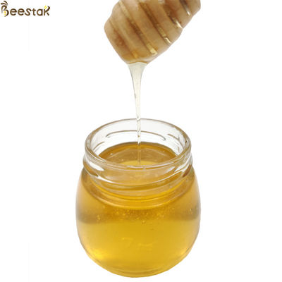 شراء بالجملة عسل زهرة ووبي 100% عسل النحل الطبيعي مع لون اللون الخفيف 18.7% الرطوبة و 73.4% خفض السكر التصنيع عبر الإنترنت
